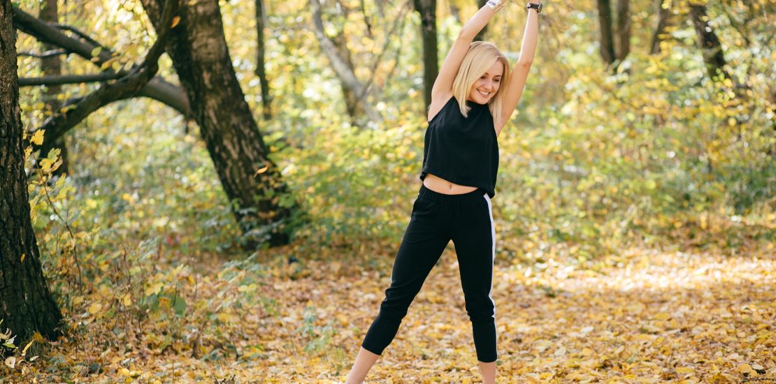 young girl walking in autumn park